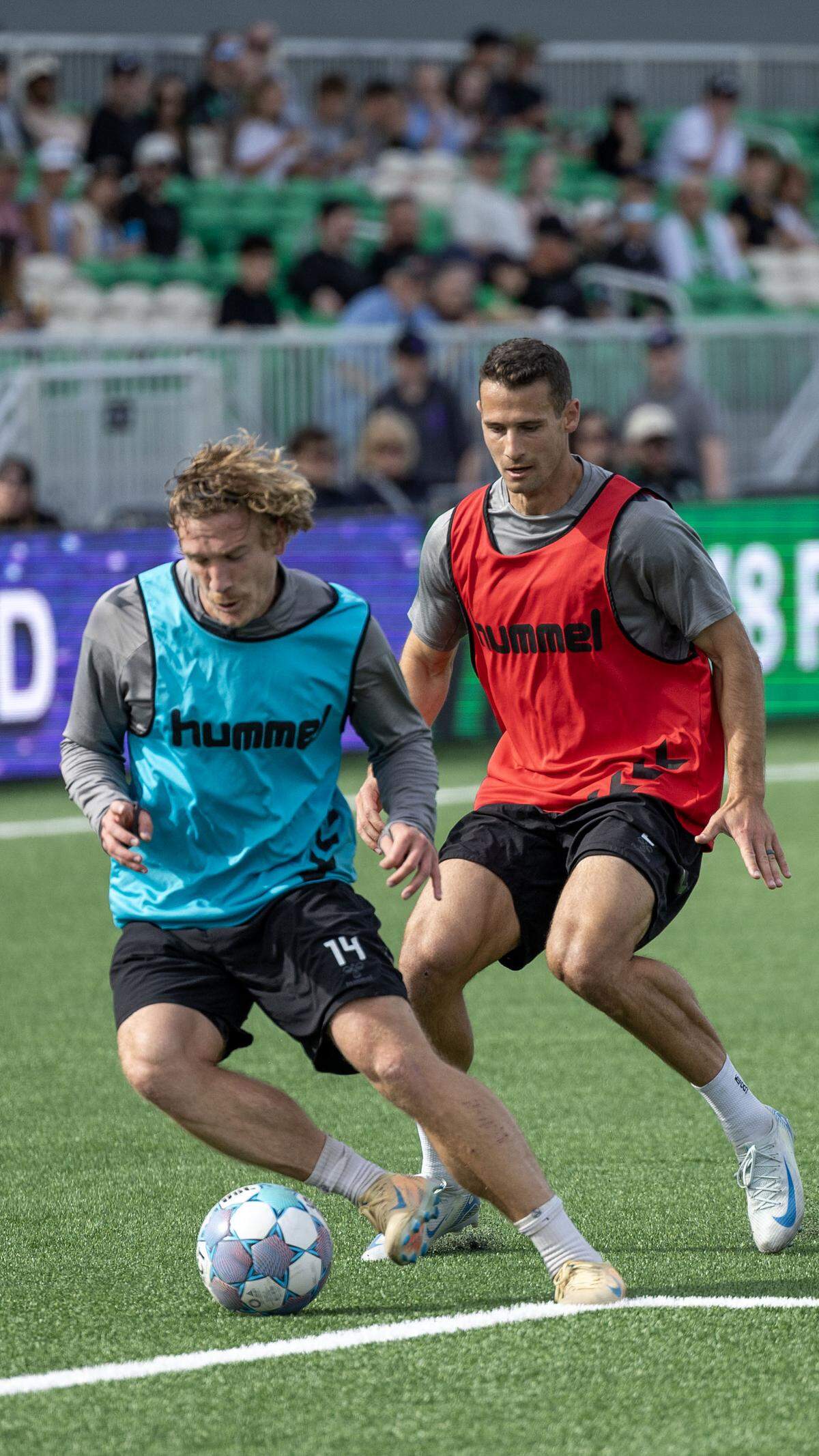 Athletic Club Boise players Nick Moon and Jonathan Ricketts, right, scrimmage in front of fans at the debut of the new soccer pitch and stadium at Fan Fest, Saturday, March 28, 2026.