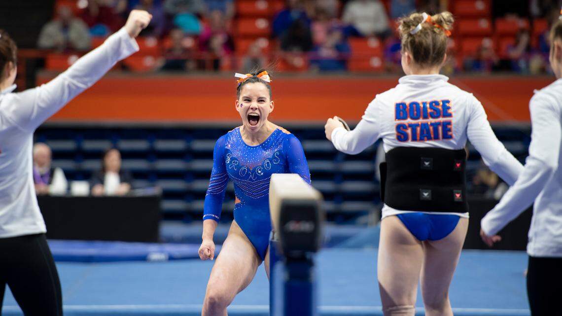 Boise State sophomore Gabriela Bouza celebrates her career-high score of 9.900 on balance beam Friday night at Taco Bell Arena.