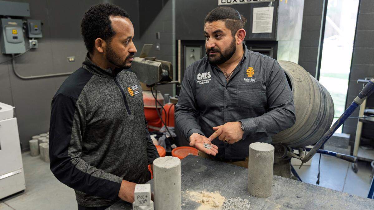 Idaho State University researchers Tadesse Wakjira, principal investigator (left), and Mustafa Mashal, lead inventor (right), stand behind Sweetcrete samples and key ingredients in their lab.
