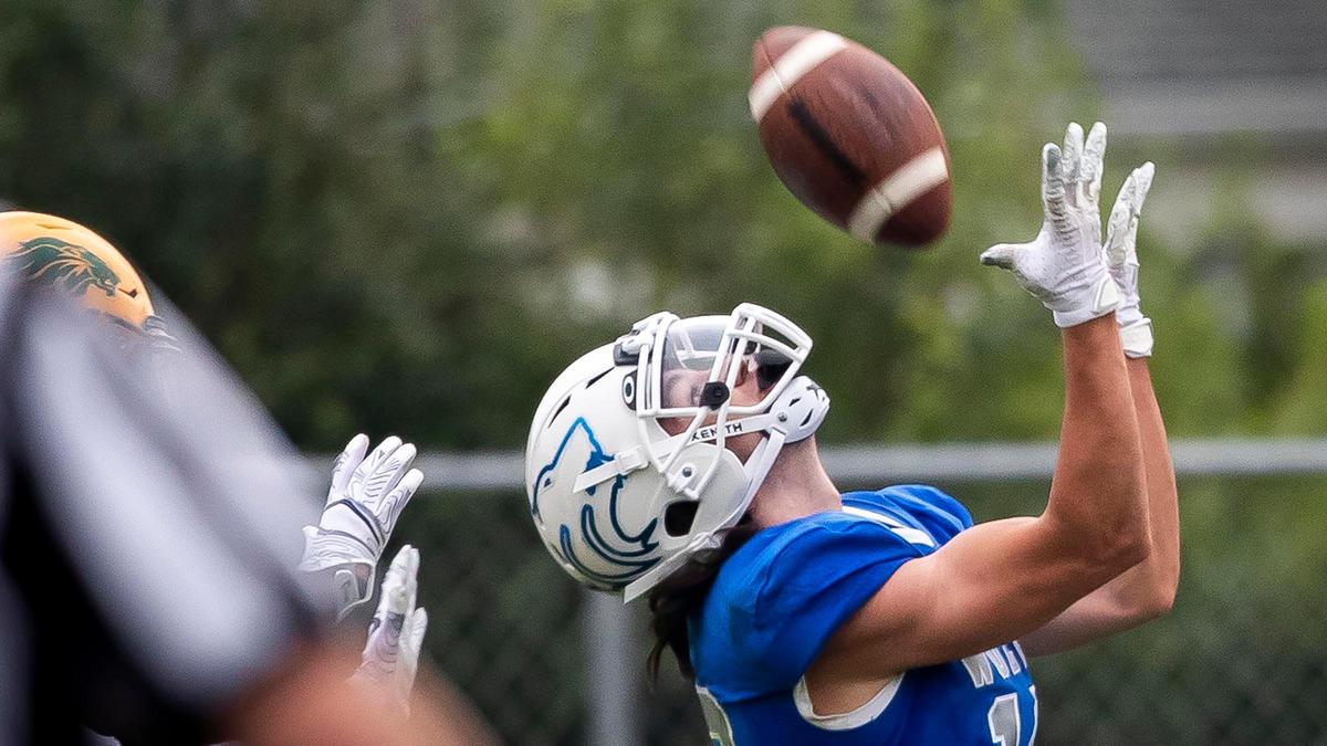Timberline wide receiver Garrett Lavin hauls in an over-the-shoulder touchdown last season against Borah.