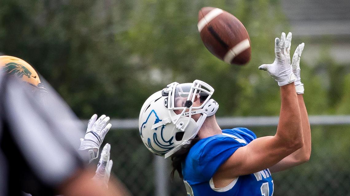 Timberline wide receiver Garrett Lavin catches a touchdown pass over his head in the Wolves’ 26-6 win over Borah on Friday, Sept. 18, 2020. The game was played at Timberline High’s practice field and was the season opener for both football teams after COVID restrictions delayed the season.
