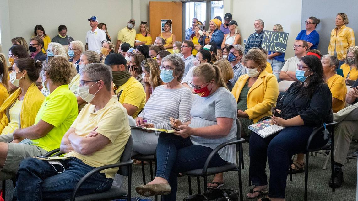 Over 70 people wearing yellow attended the Boise School District meeting Monday evening in a silent protest of the board’s decision last week to make masks mandatory for the start of the school year amid a COVID-19 surge.