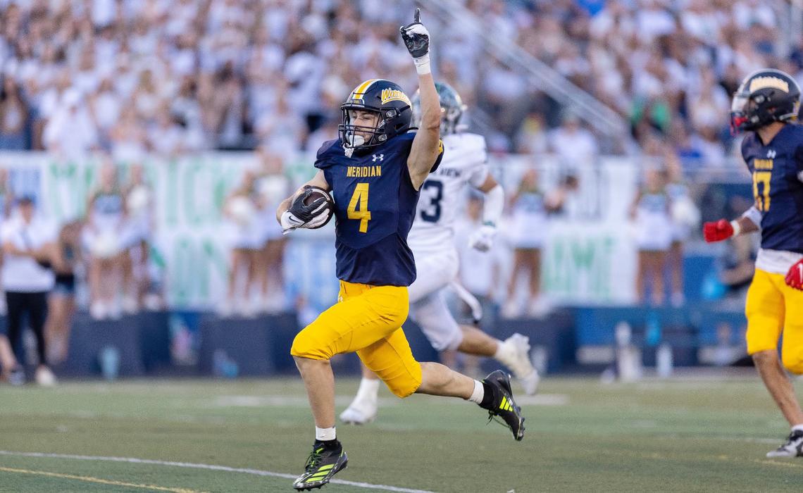 Meridian wide receiver senior Carver Martin celebrates a touchdown earlier this season against Mountain View. The Warriors travel to Kuna for a winner-to-state game Friday.