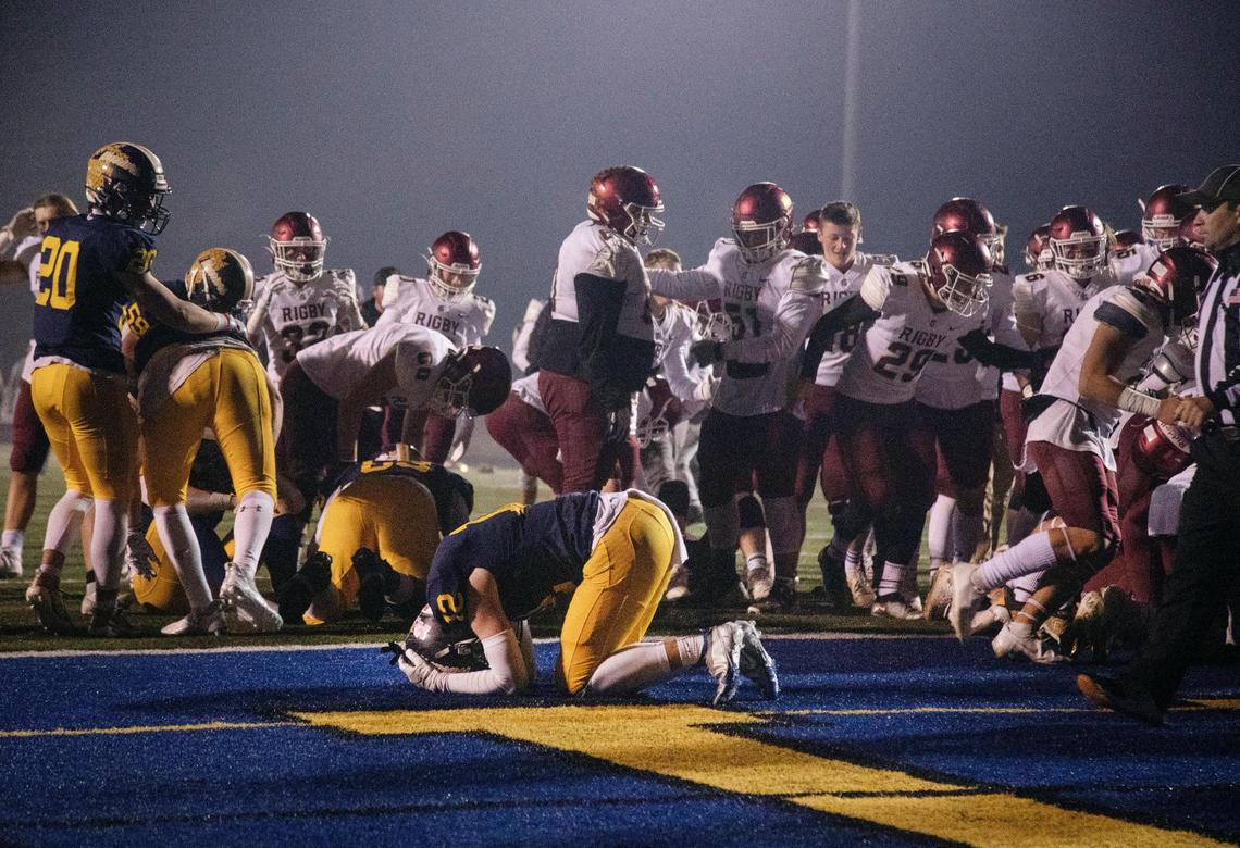 Rigby celebrates while Meridian is dejected after the Trojans’ 55-49, triple-over win the the 5A state semifinals Friday.