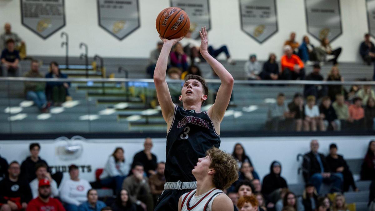 Centennial guard Payton Knudson pulls up for a basket against Owyhee in the district semifinals last season.