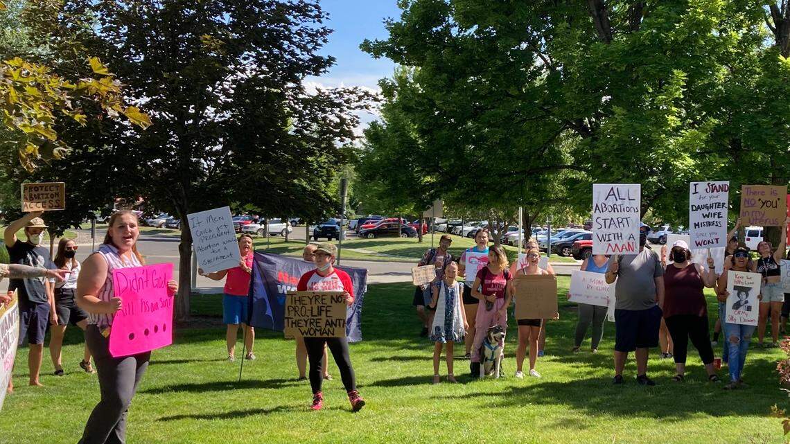 Abortion rights protesters chant and hoist signs at the College of Southern Idaho campus in Twin Falls, where the Idaho GOP was hosting its state convention. Idaho Republicans passed a law banning abortion in 2020, which was triggered by the U.S. Supreme Court’s decision to abandon federal abortion protections.