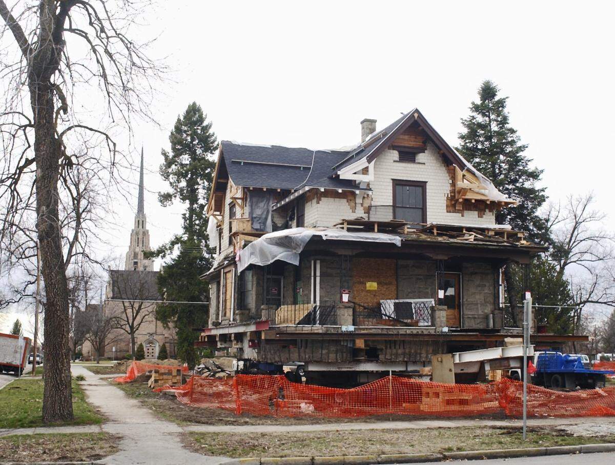 Jim and Monica Walker's house, purchased for $1 from the Cathedral of the Rockies, awaits its move in 2006 to a new site. The church moved or demolished at least eight homes to make way for a planned apartment house with underground parking. The project was never built. The then-101-year-old house was the final historic dwelling moved from the block adjacent to the cathedral. The house  didn't go far: it now stands at the corner of 12th and Hays streets.