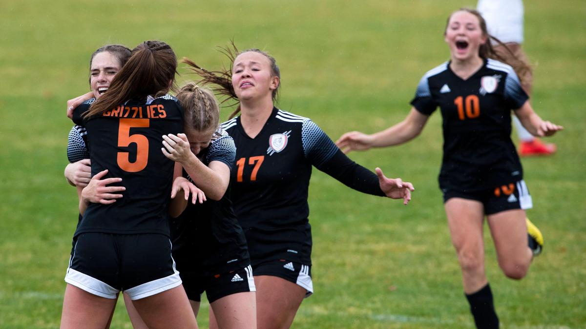 Fruitland junior Abbi Roubidoux (left, facing) is swarmed by teammates after her game-winning goal against Sun Valley in the 3A girls soccer championship game Saturday at Middleton High School.