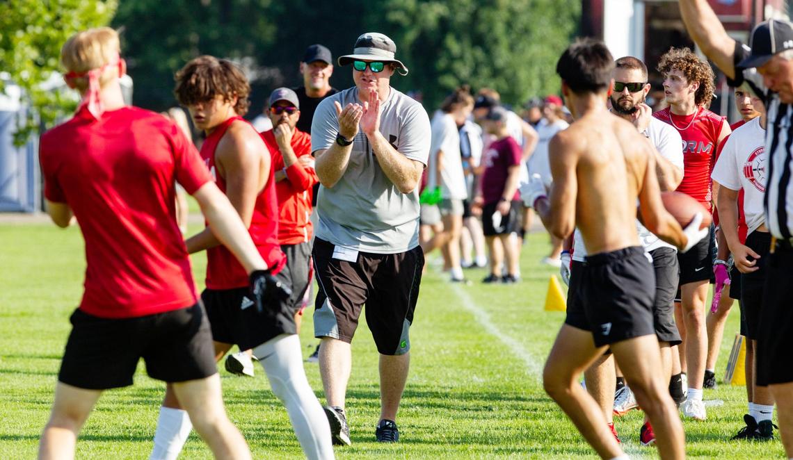 Owyhee football coach Sherm Blaser fires up his team during the Famous Idaho Potato Bowl 7-on-7 Tournament on Friday. Blaser left Kuna to found the first-year program in the West Ada School District.