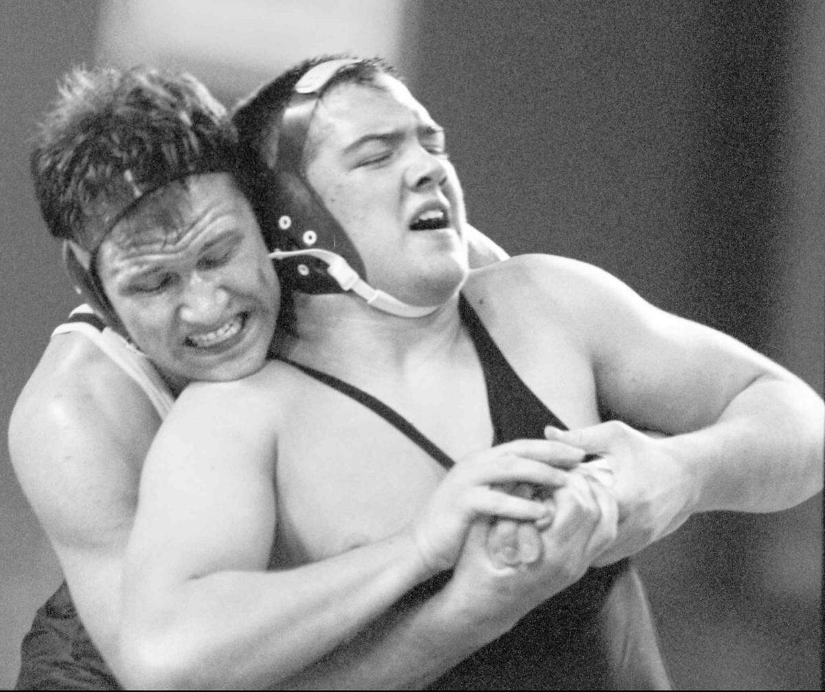 Jeff Schmedding of University High, right, won an overtime 215 pound AAA state semifinal match against Trevor Howard of Mercer Island at the Tacoma Dome in 1996. The Spokesman-Review