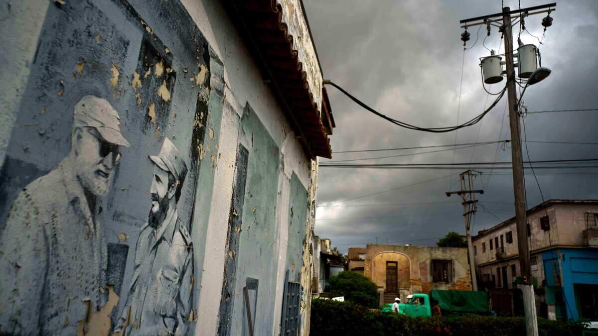 A mural featuring Fidel Castro shaking hands with American author Ernest Hemingway, left, at a parking lot in Havana, Cuba. Idaho scholar Marty Peterson and Sen. John McCain were Hemingway fans, and Peterson got McCain’s help preserving Hemingway’s Cuban estate.