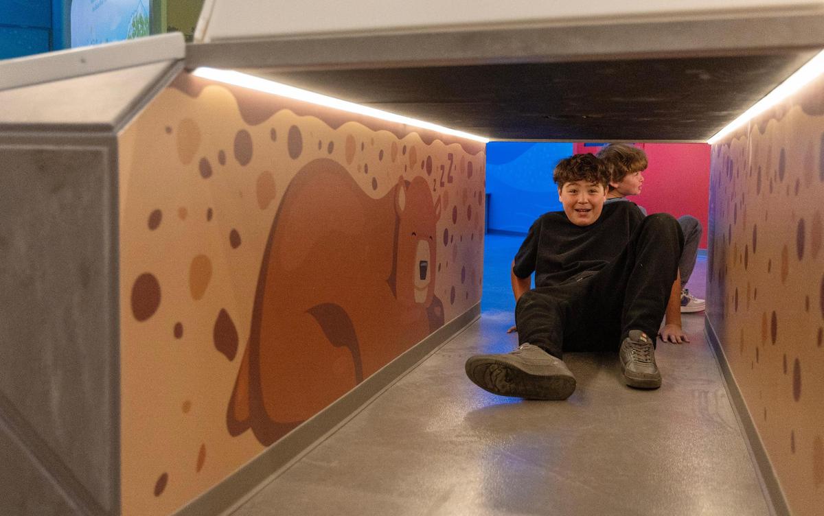 Students Filero Cruz, 11, left, and Niko Wright, 11, explore an exhibit at the WaterShed Climate + Water Education Center on March 13. The WaterShed has recently remodeled.