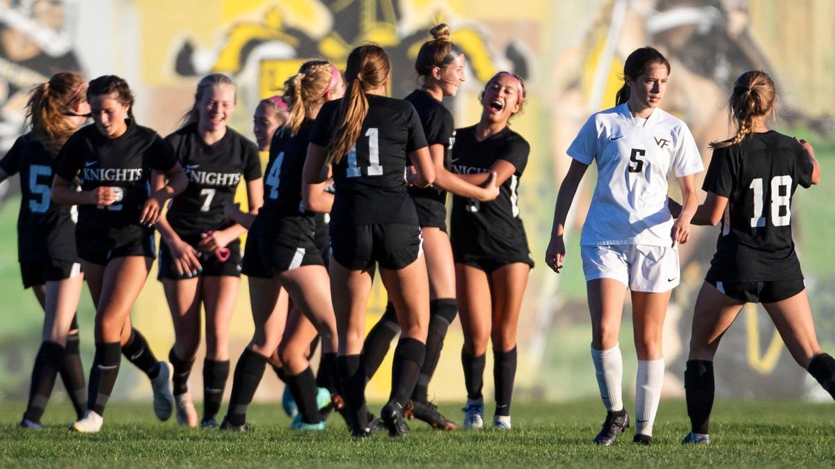 Bishop Kelly forward Izzy Reyes, center, receives praise from her teammates after a goal in the second half against 4A SIC foe Vallivue on Thursday in Boise.