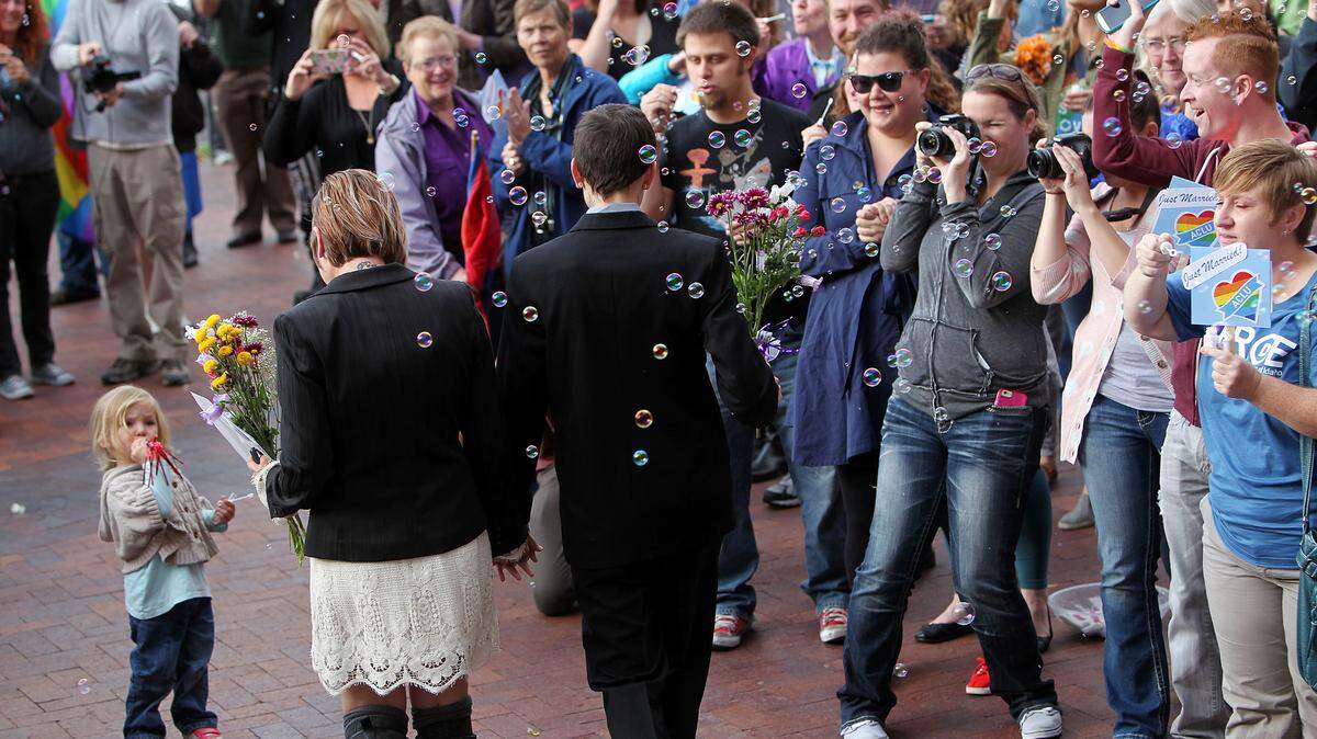 Well wishers blow bubbles and cheer as same-sex couples make their way out of the Ada County Courthouse after receiving their marriage licenses in this file photo from Wednesday, Oct. 15, 2014, after a federal appeals court upheld a lower court’s ruling that overturned Idaho’s ban on same-sex marriages as unconstitutional.