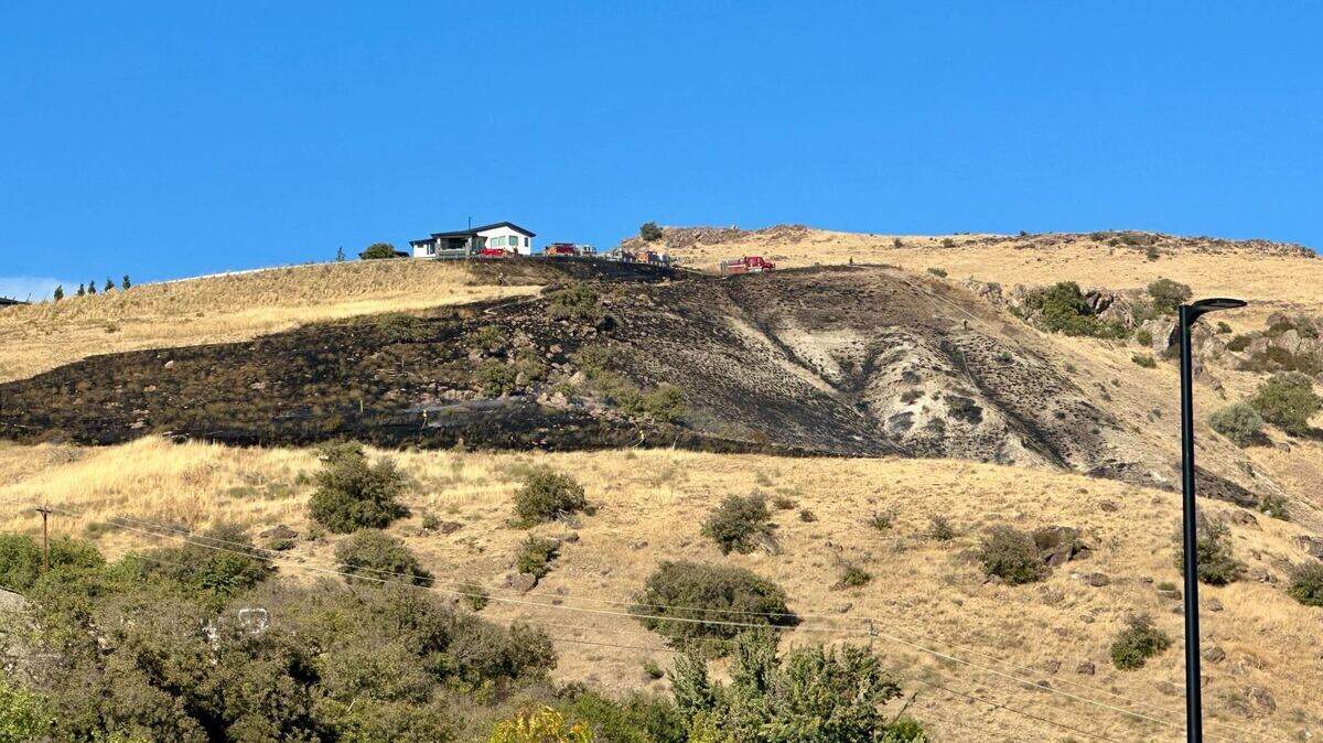 A fire in the Warm Springs Mesa area of Boise spread to about 10 acres shortly before 5 p.m. Wednesday. Fire crews protected two houses that were initially threatened.