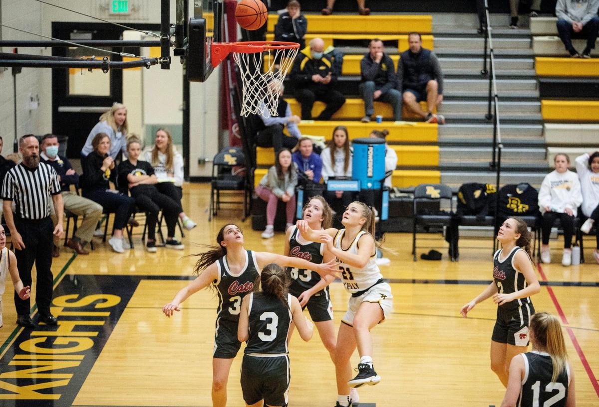 Bishop Kelly junior Caroline Knothe watches a shot fall Tuesday during the Knights’ 42-29 win over Columbia in the 4A District Three Tournament semifinals.
