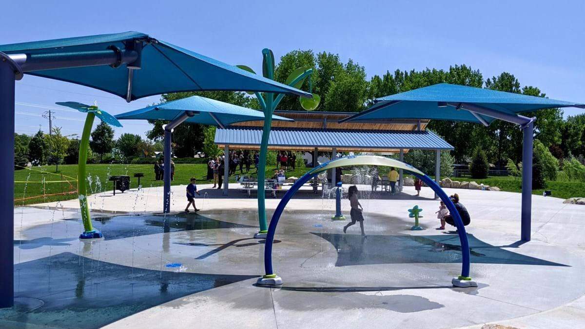 Kids play in the new splash pad at Molenaar Park in Boise. 