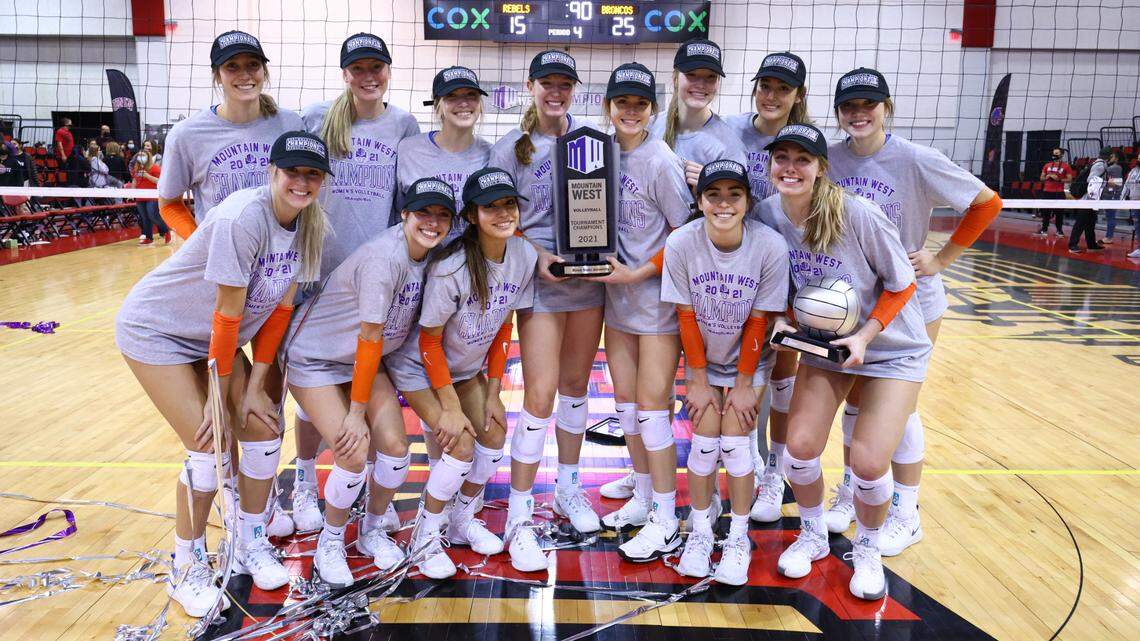 The Boise State volleyball team poses with the Mountain West championship trophy after storming to the title as the No. 6 seed. The Broncos fell to BYU 3-0 in the first round of the NCAA Tournament on Friday.