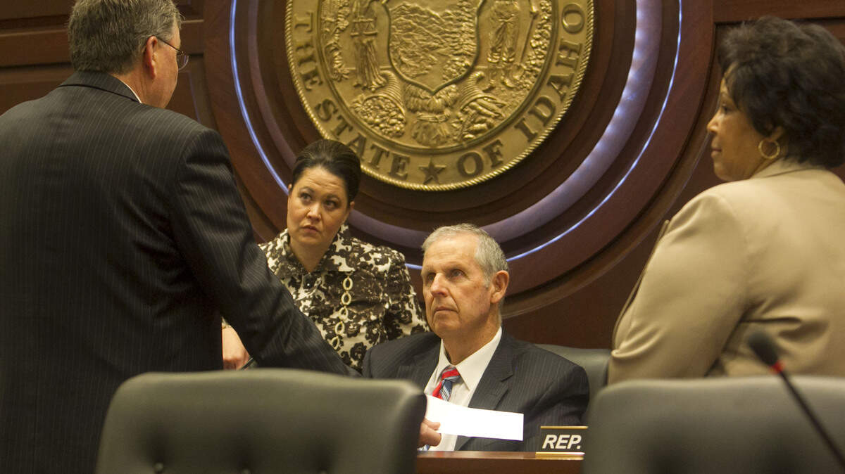 Rep. Tom Loertscher, R-Iona, talks with House Speaker Scott Bedke before a House State Affairs Committee hearing in January 2015 on a proposal to ban discrimination against gay, lesbian and transgender people.