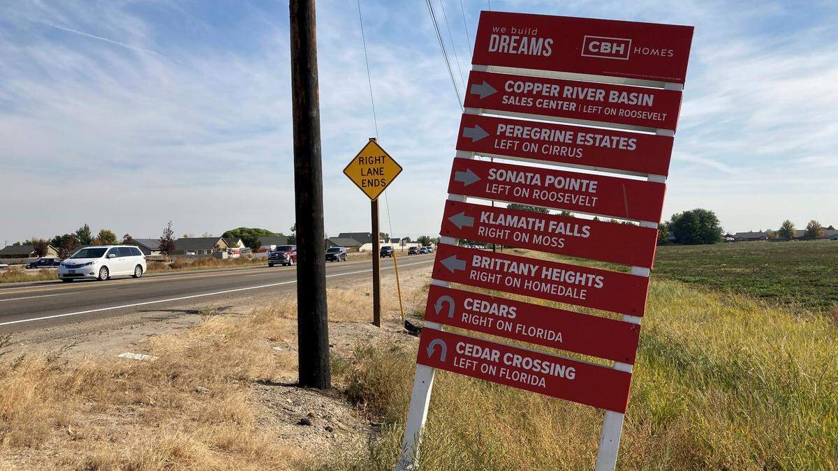 CBH Homes advertises seven of its residential subdivisions in the Nampa area from this sign at the edge of a farm field along Idaho 55, Karcher Road.