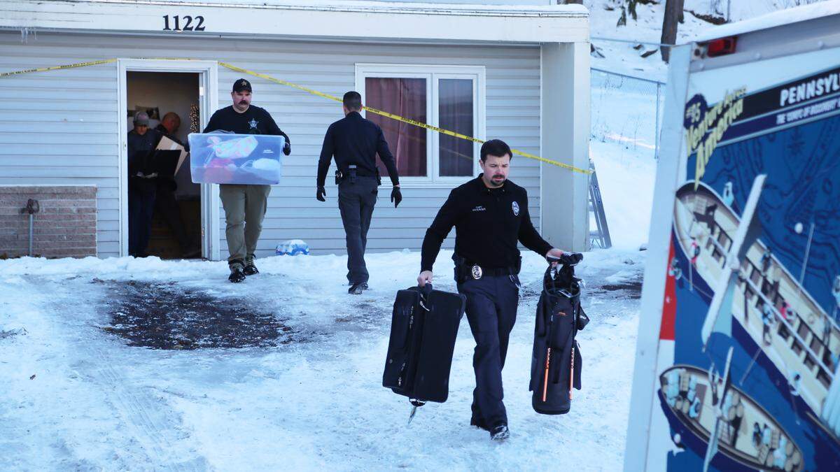 Moscow Police Capt. Anthony Dahlinger, right, and other members of law enforcement packed and removed the personal belongings of the University of Idaho homicide victims from their rental house to return to their families.