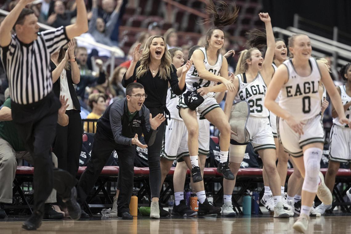 Eagle’s bench explodes after a teammate hits a 3-pointer in the fourth quarter of the state 5A girls basketball championship Saturday, Feb. 16, 2019 at Ford Idaho Center in Nampa. Eagle defeated Mount View 51-47 to win the state title.