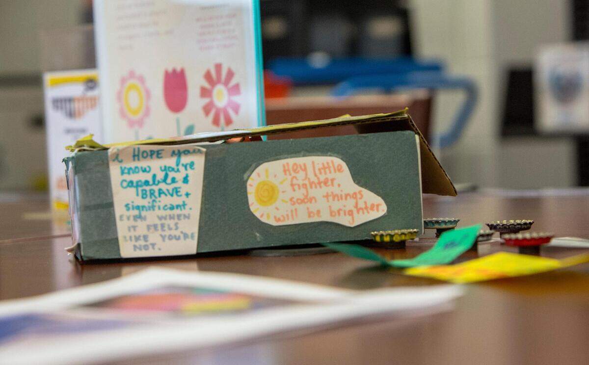 One of library assistant Paige Thomas’ guerrilla kindness initiatives encourages patrons of the Collister branch to leave kind notes in a box at the checkout counter. Thomas then inserts the notes into the books on hold that are waiting to be taken home.