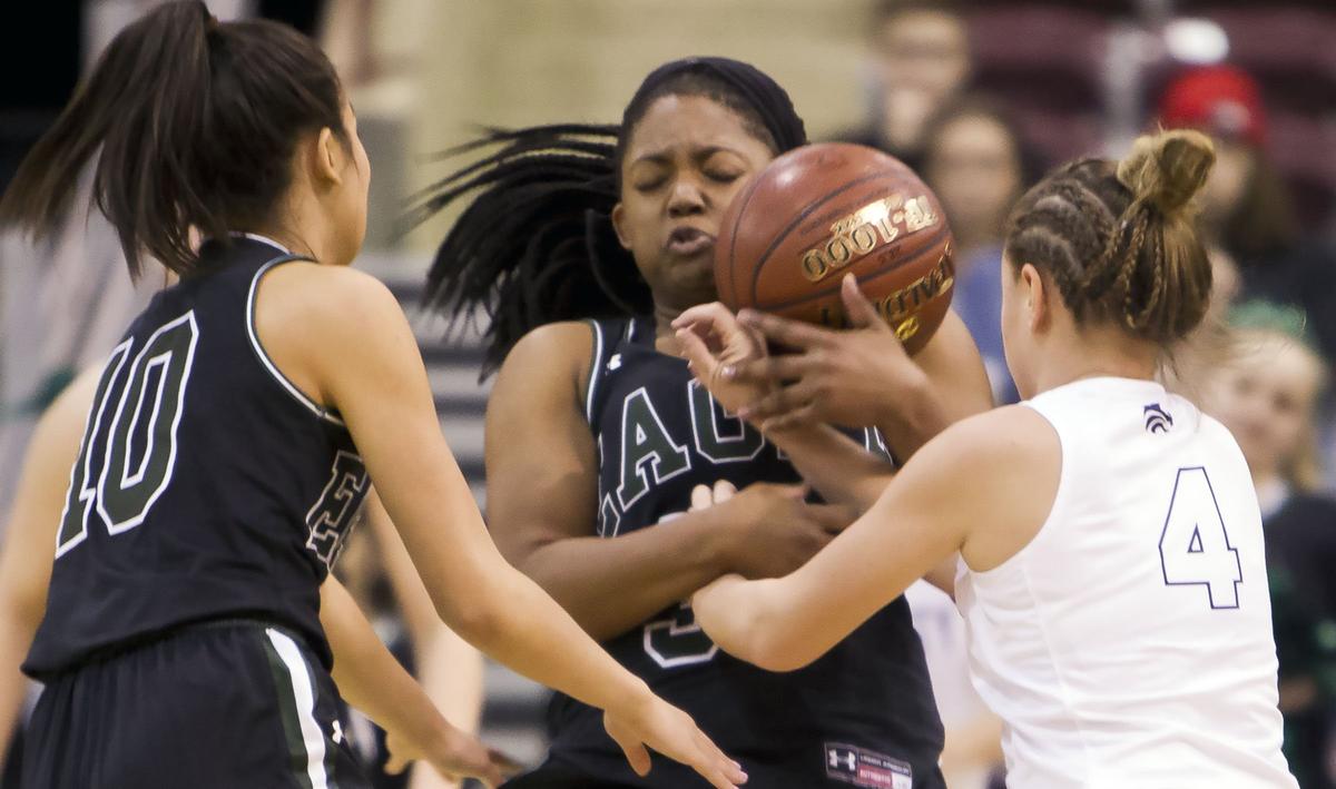 Eagle senior Jaimee McKinnie steals the ball from Lake City’s Chloe Teets in the first round of the 5A girls basketball state tournament Thursday, Feb. 14, 2019 at Ford Idaho Center in Nampa.