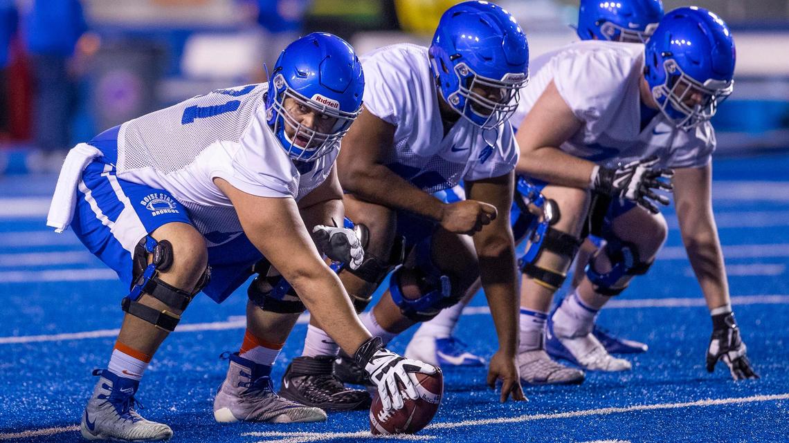 Boise State offensive lineman Donte Harrington readies to hike the football in scrimmage during the Broncos’ first spring practice March 6 at Albertstons Stadium. On Friday, Boise State announced all athletes will have to test negative for the coronavirus before they’re allowed to practice.