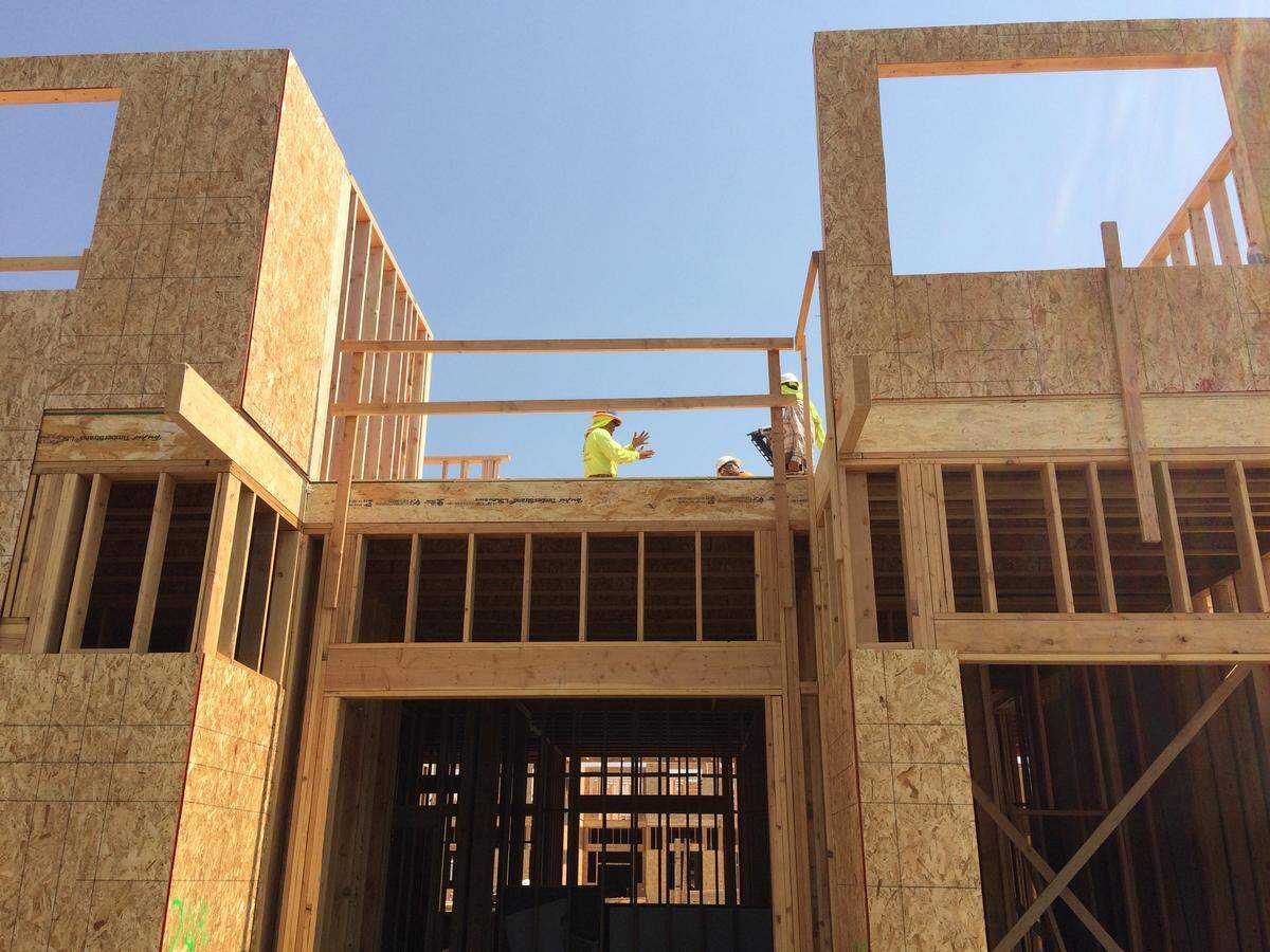 Construction workers put up the second floor of the four-story Adare Manor apartments for low- and moderate-income people Wednesday, Aug. 8, in the 2400 block of West Fairview Avenue in Boise.  One hundred twenty one apartments will be rented to households whose income does not exceed 60 percent of the area median income (about $38,580 for a family of four), and 13vapartments will be leased at market rates, according to the Capital City Development Corp.