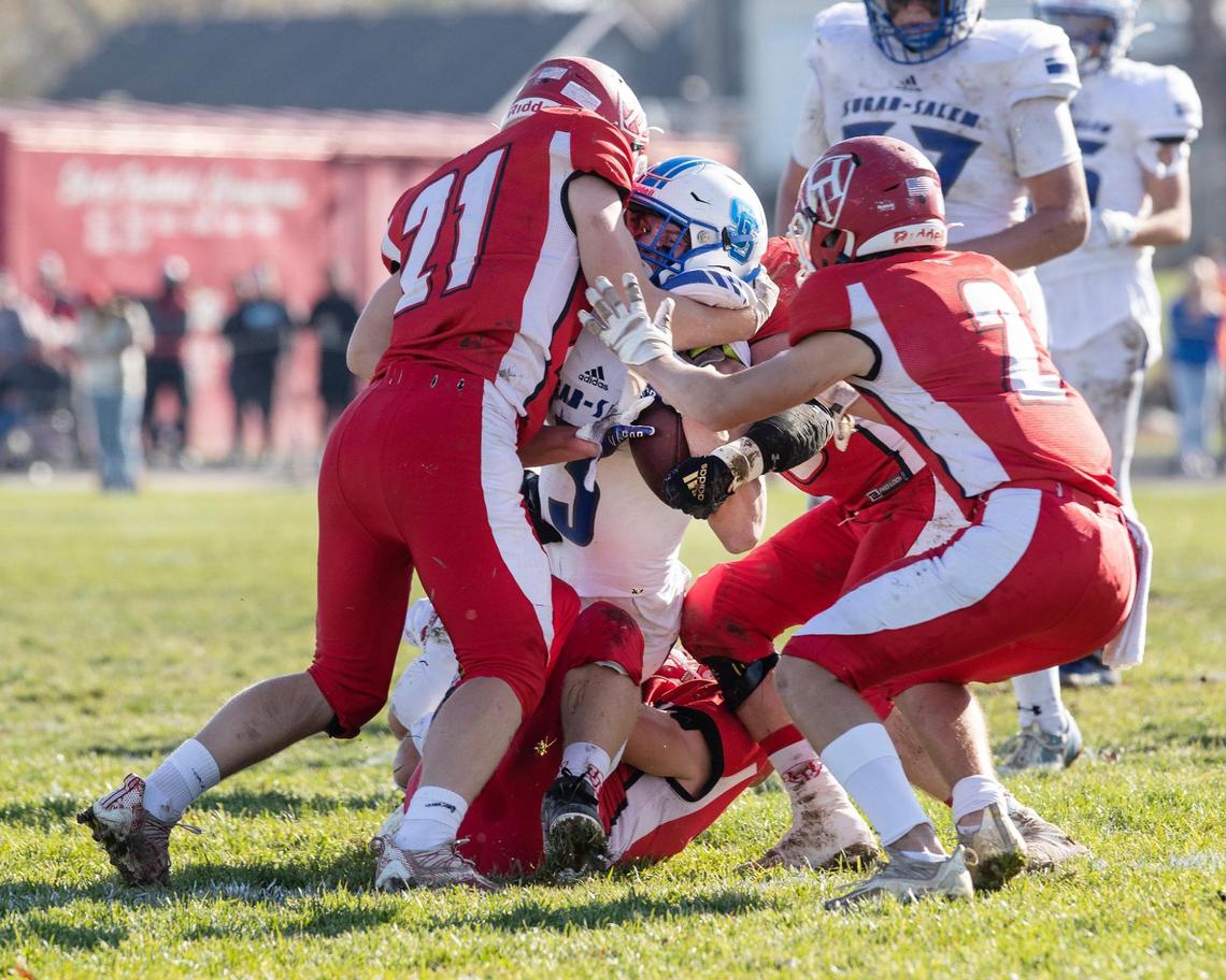 Homedale gang tackles Sugar-Salem wide receiver Cooper Butikofer in the first half Saturday.