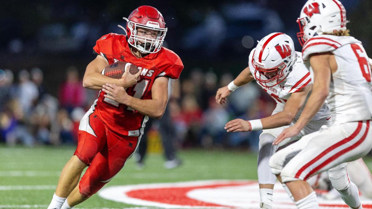 Homedale running back Andrew Marston hits the edge of the Weiser defense on Oct. 6.