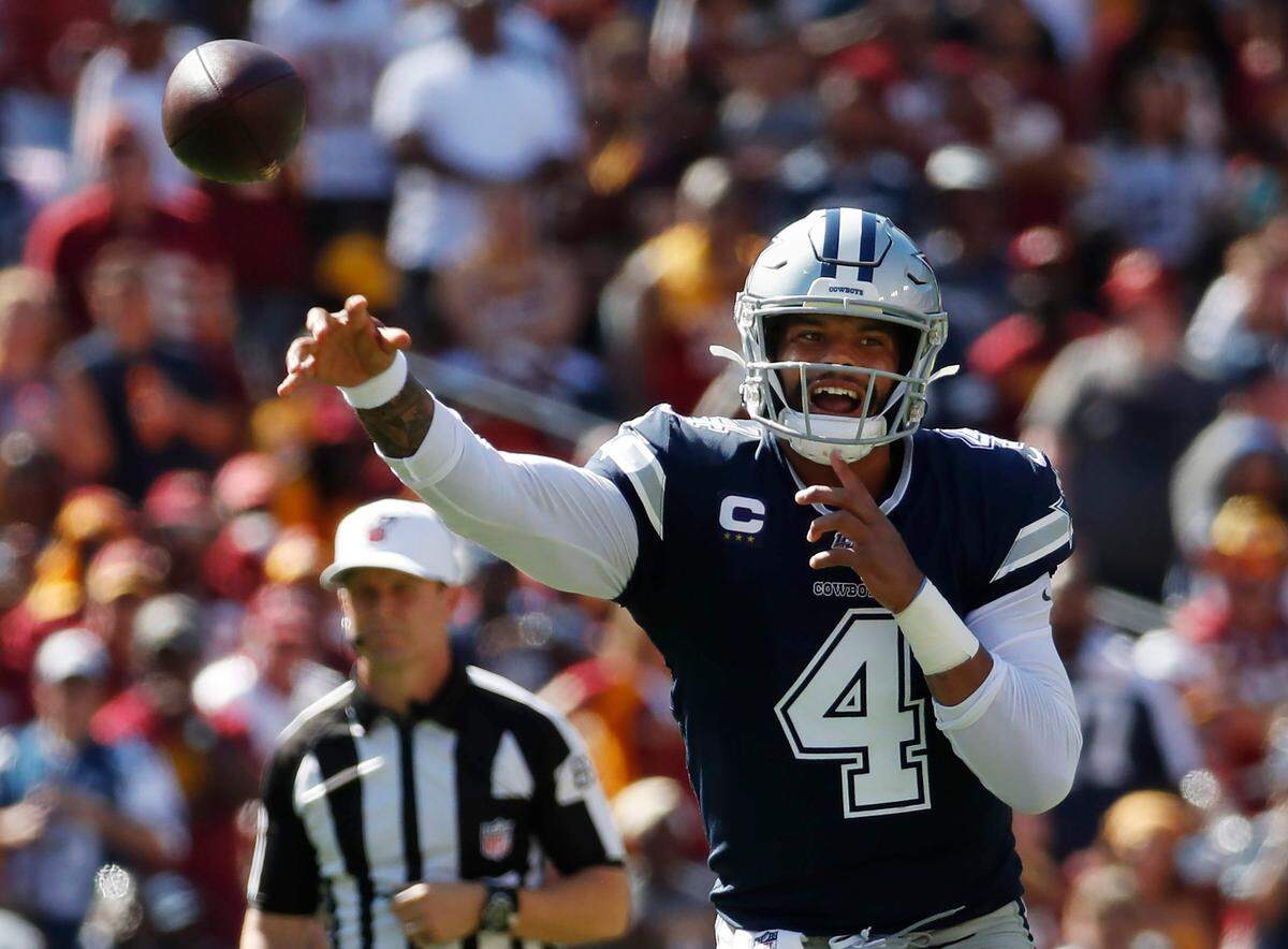 Dallas Cowboys quarterback Dak Prescott passes downfield during the second half Sunday
