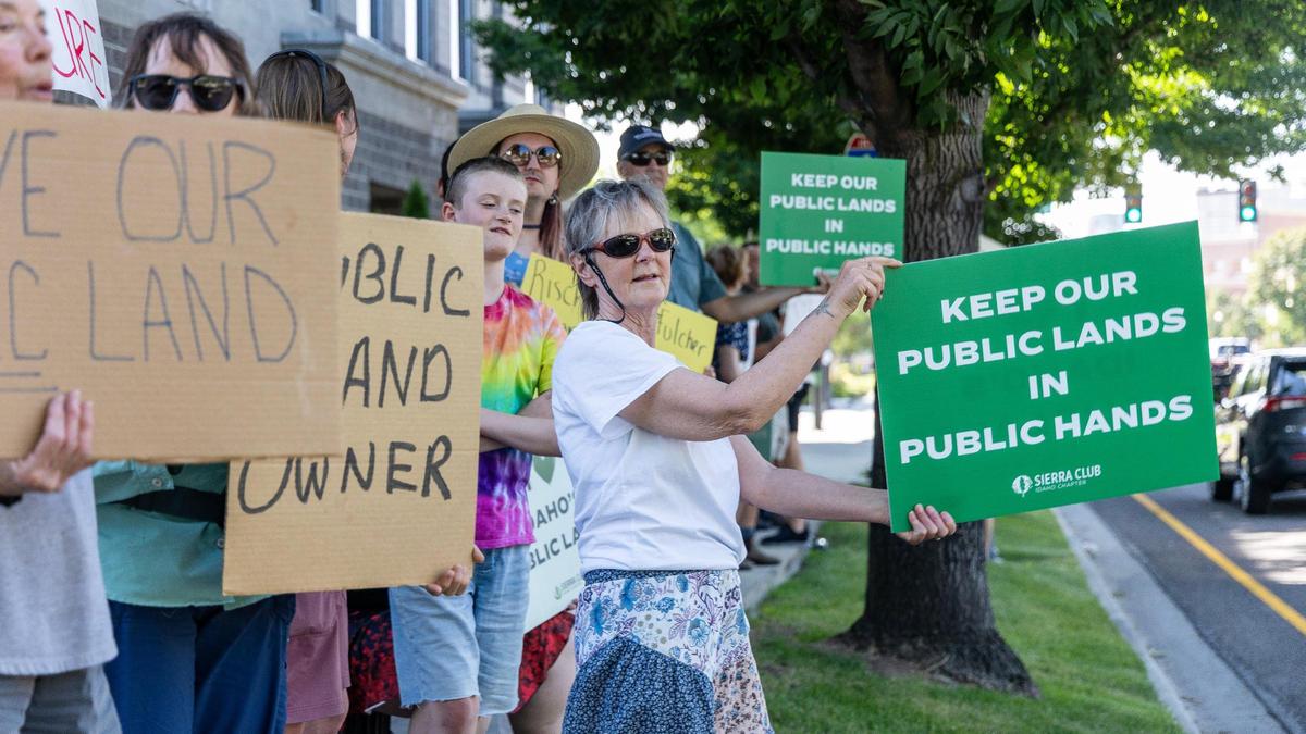 Pam Piper-Ruth, center, protests alongside three generations of her family in favor of conserving public lands.