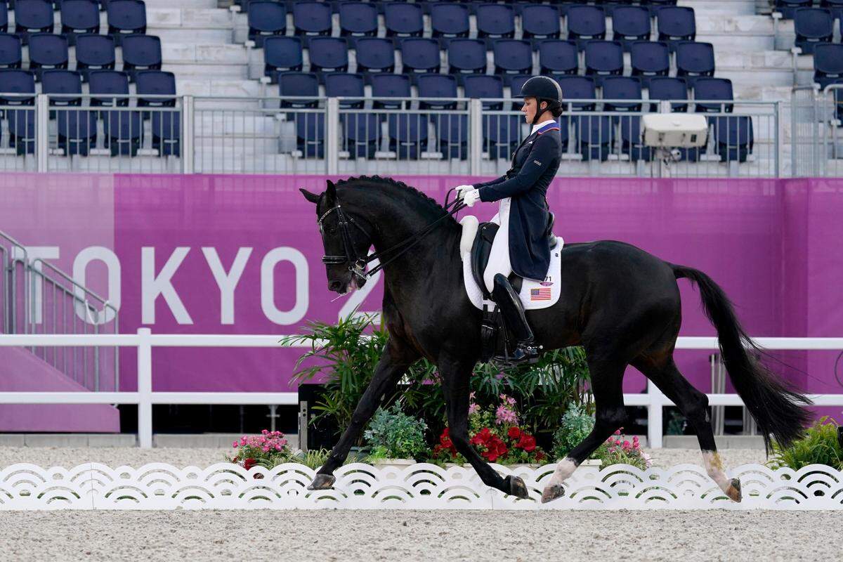 Adrienne Lyle, of the United States, riding Salvino, competes in the equestrian dressage team final at the 2020 Summer Olympics, Tuesday, July 27, 2021, in Tokyo. (AP Photo/Carolyn Kaster)