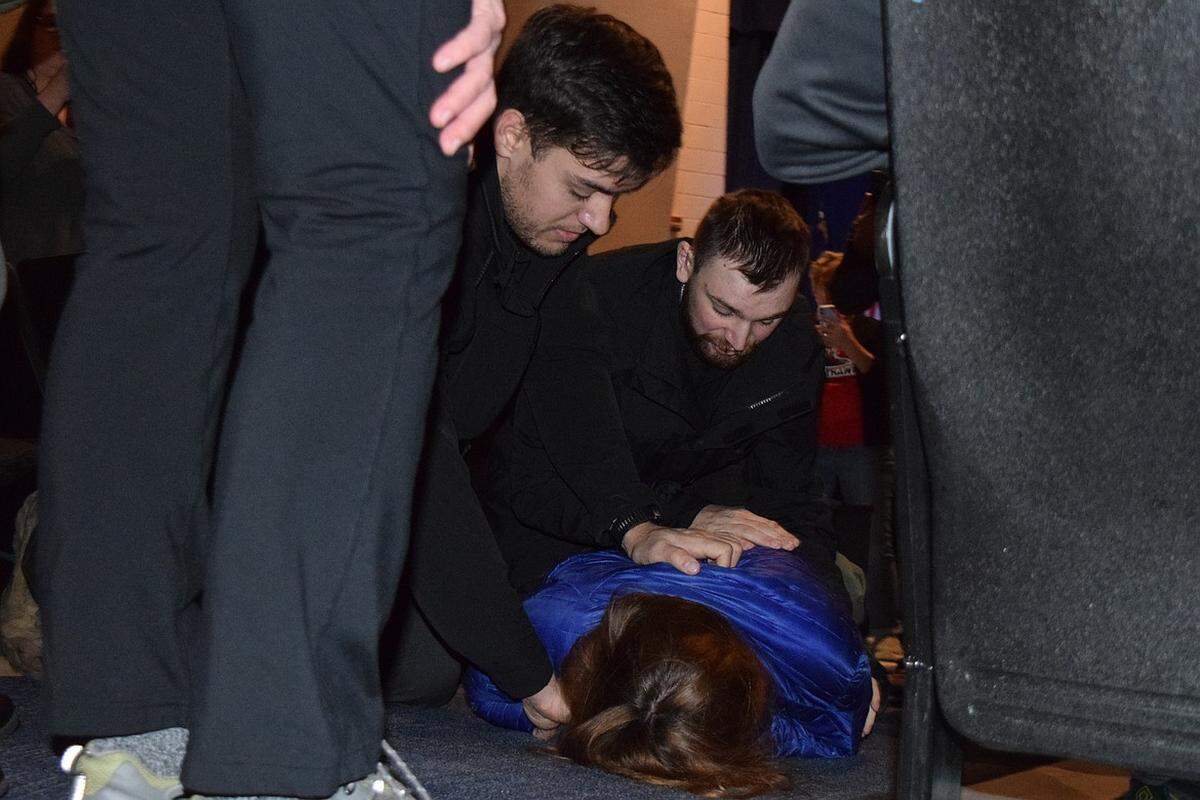 Borrenpohl is seen held against the ground after a Feb. 22 Legislative Town Hall, hosted by the KCRCC, turned volatile.