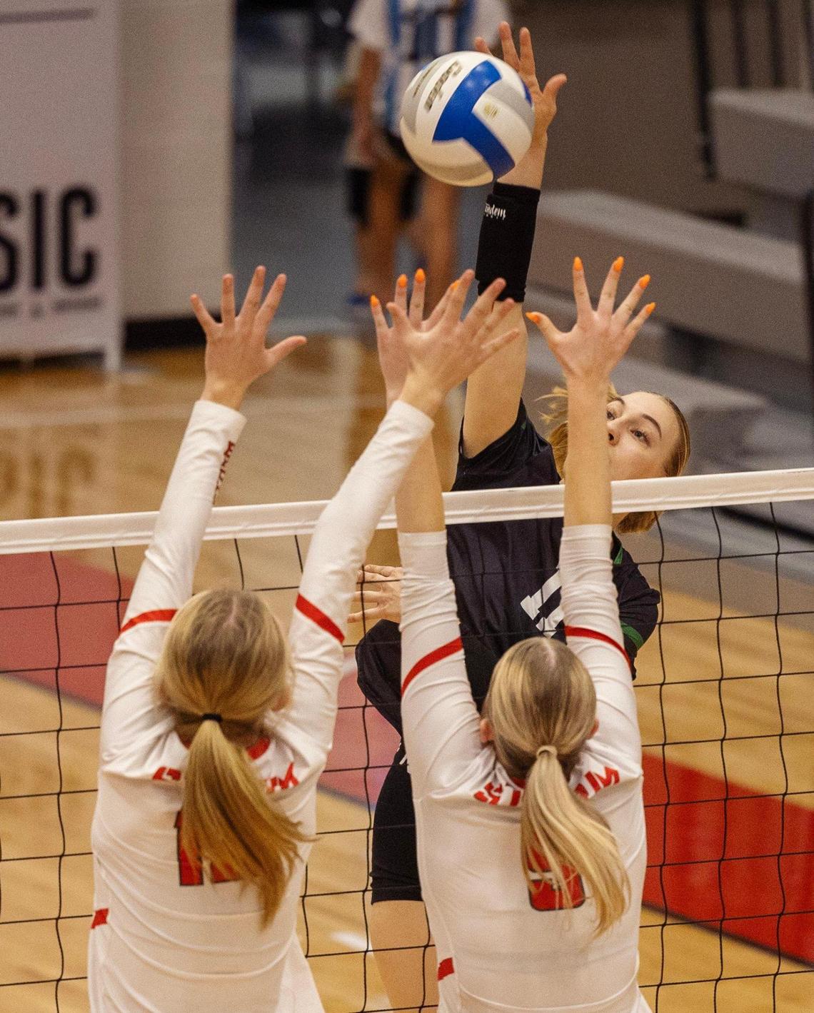 Eagle’s Maija Howse hits the ball past Owyhee blockers last season.