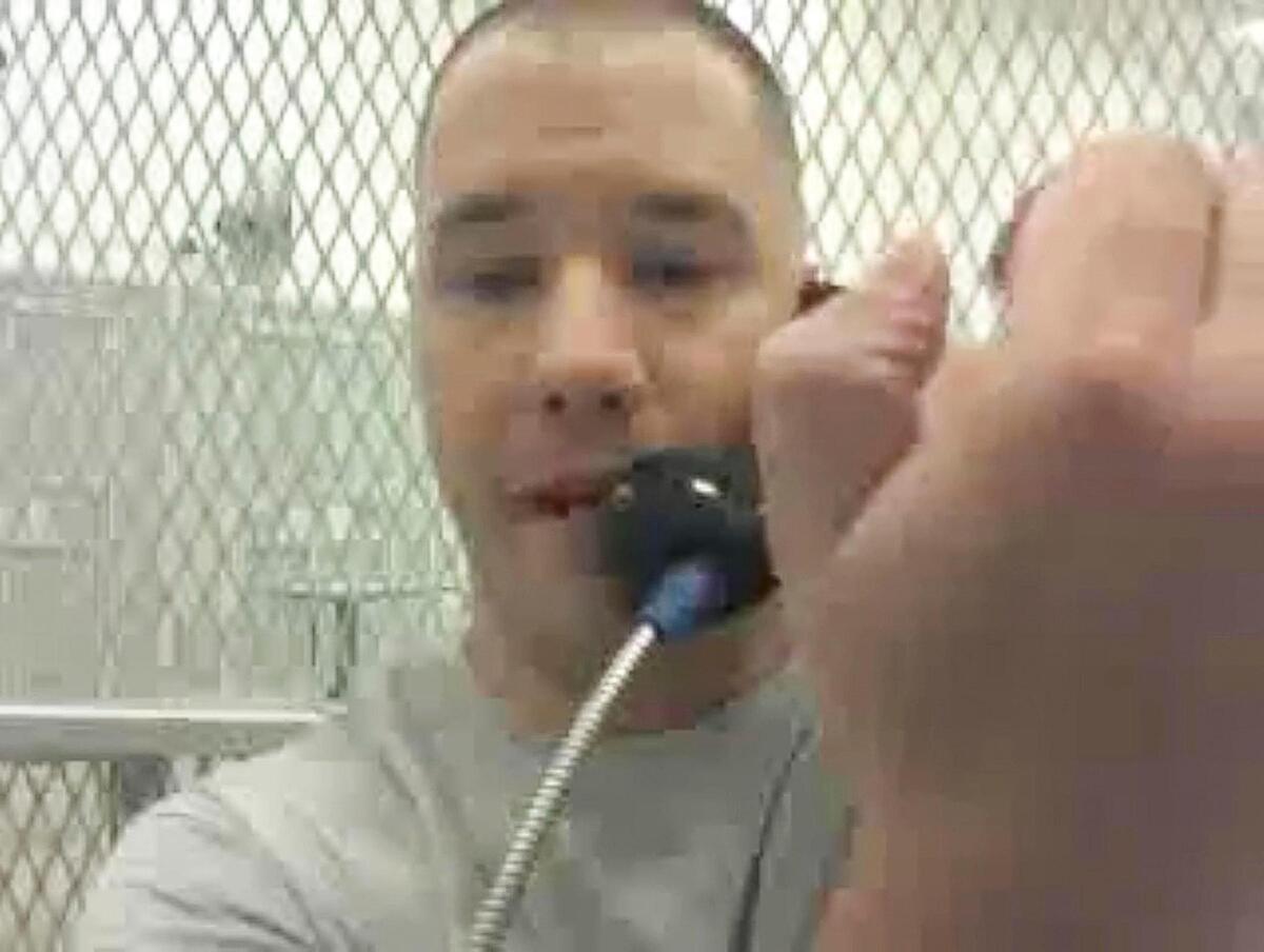 Bobby Templin holds his hand up, showing he is unable to close his thumb, while recording a video from inside the Idaho Maximum Security Institution. He waited for months to get medical attention for his broken hand.