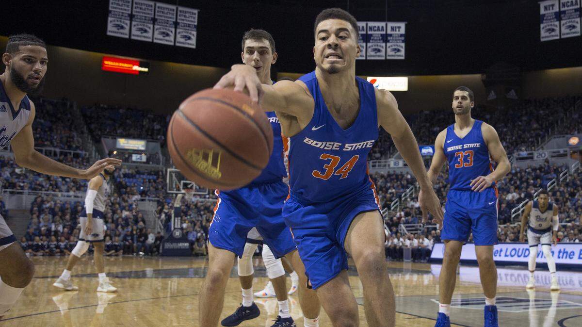 Boise State guard Alex Hobbs tries to save the ball in the first half against Nevada on Saturday in Reno, Nev.