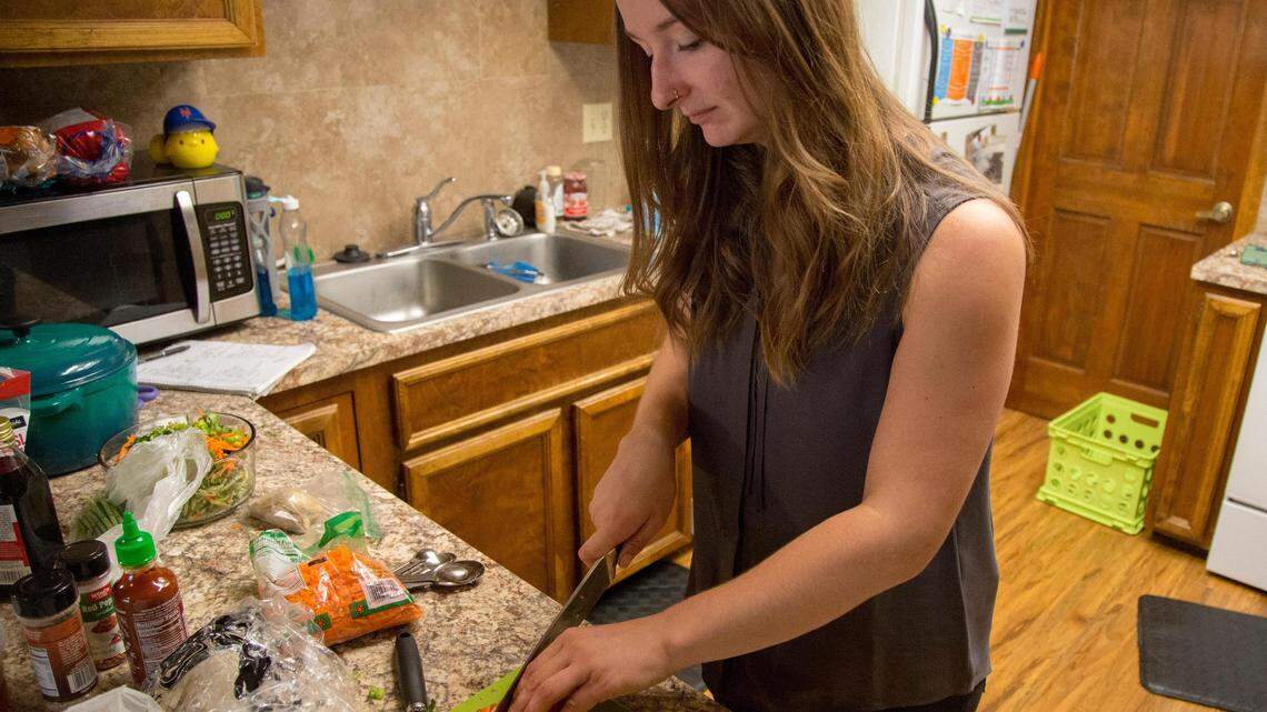 Canyon County “glamping” enthusiast Christina Byrn prepares chicken satay walking tacos, one of the many recipes she uses while camping.