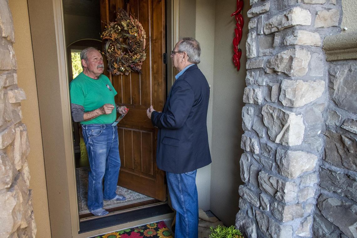 Bill Whelan, a resident of six years in Northwest Boise, talks about a recent City Council meeting with Brent Coles, a former mayor of the City of Boise. Coles was walking door-to-door Wednesday, Oct. 2, 2019 seeking votes for campaign to become mayor again.