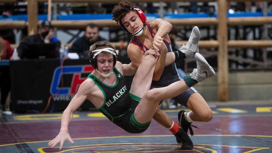 Nampa’s Dedrick Navarro, right, won his only match against Blackfoot’s Mack Mauger at the 2021 Rollie Lane Invite, pictured.