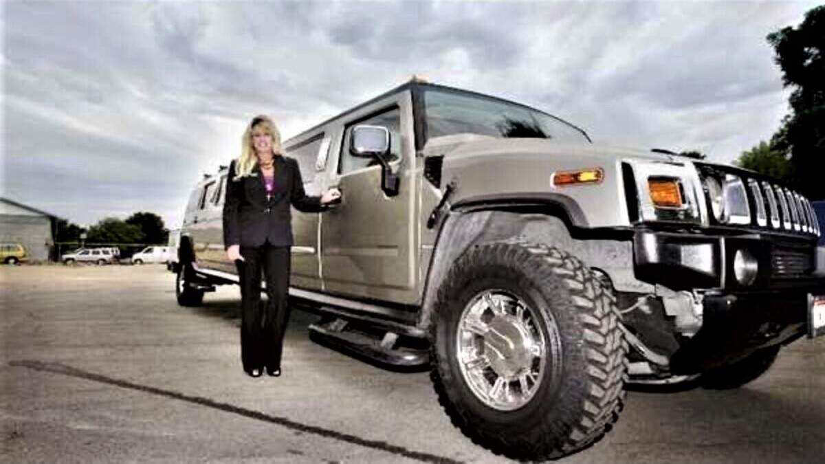 Christine Bennett, the former owner of Boise’s Showcase Limousine, next to the company’s Hummer limo.