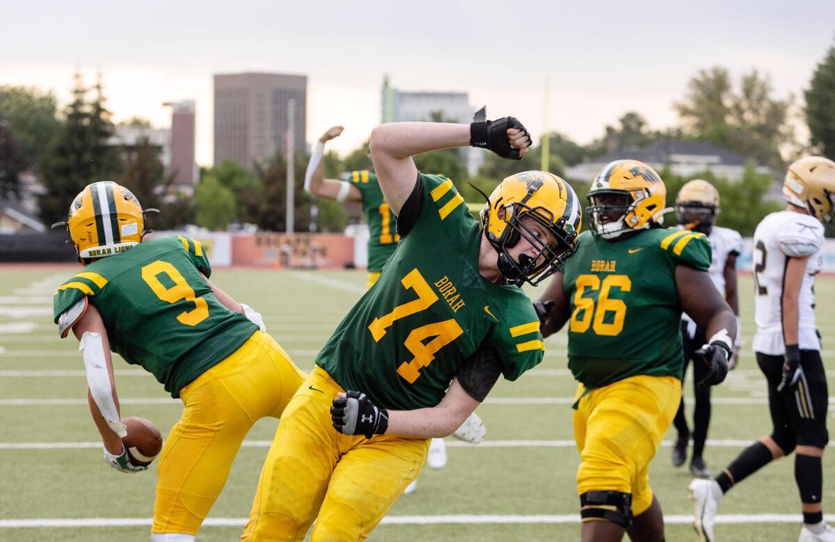 Borah offensive lineman Austin Flaherty (74) celebrates after a touchdown against Capital last season.