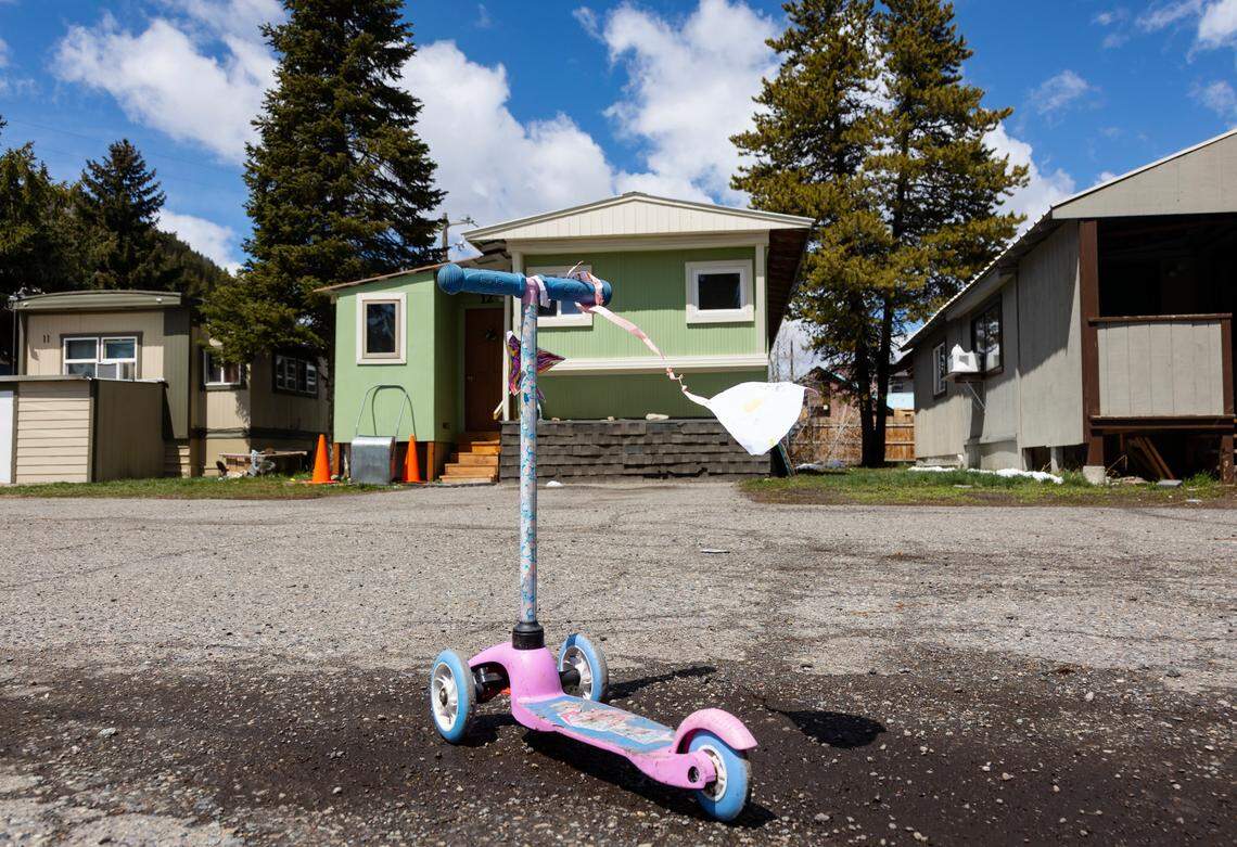 A child’s scooter is parked in the parking lot of J&J Trailer Park. Eleven families are facing eviction from the Ketchum trailer park.