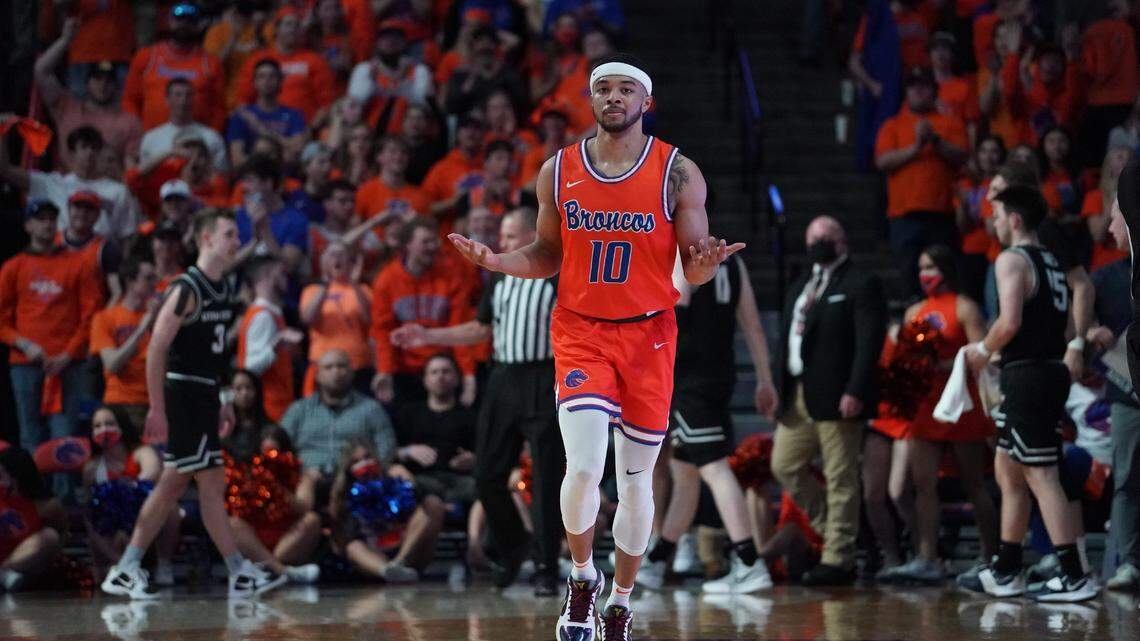 Boise State redshirt senior Marcus Shaver Jr. reacts to sinking a jump shot just before the halftime buzzer Saturday at ExtraMile Arena.