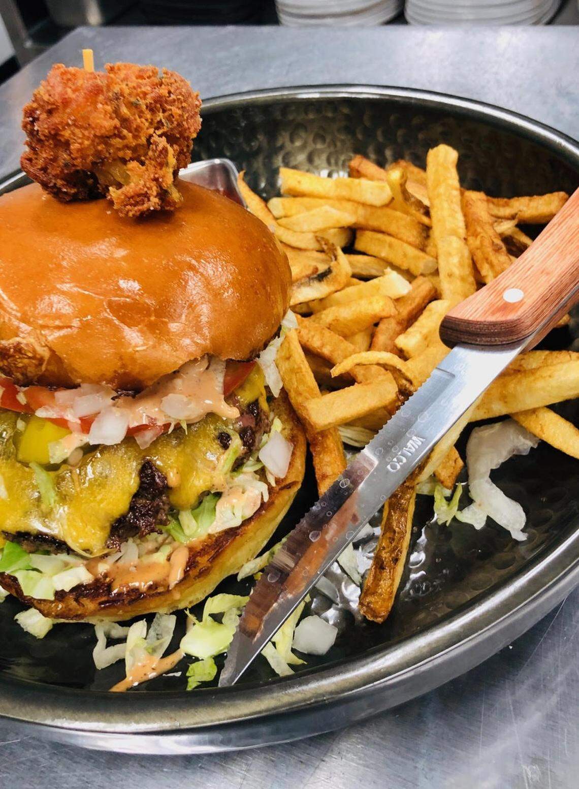 The (un)Common Burger ($13) is made with an American Kobe blend patty, Tillamook sharp cheddar cheese, ETC Sauce and a Bigwood Bread challa bun. It also has a housemade cheesy tot on top and comes with loaded house-punched Idaho fries.