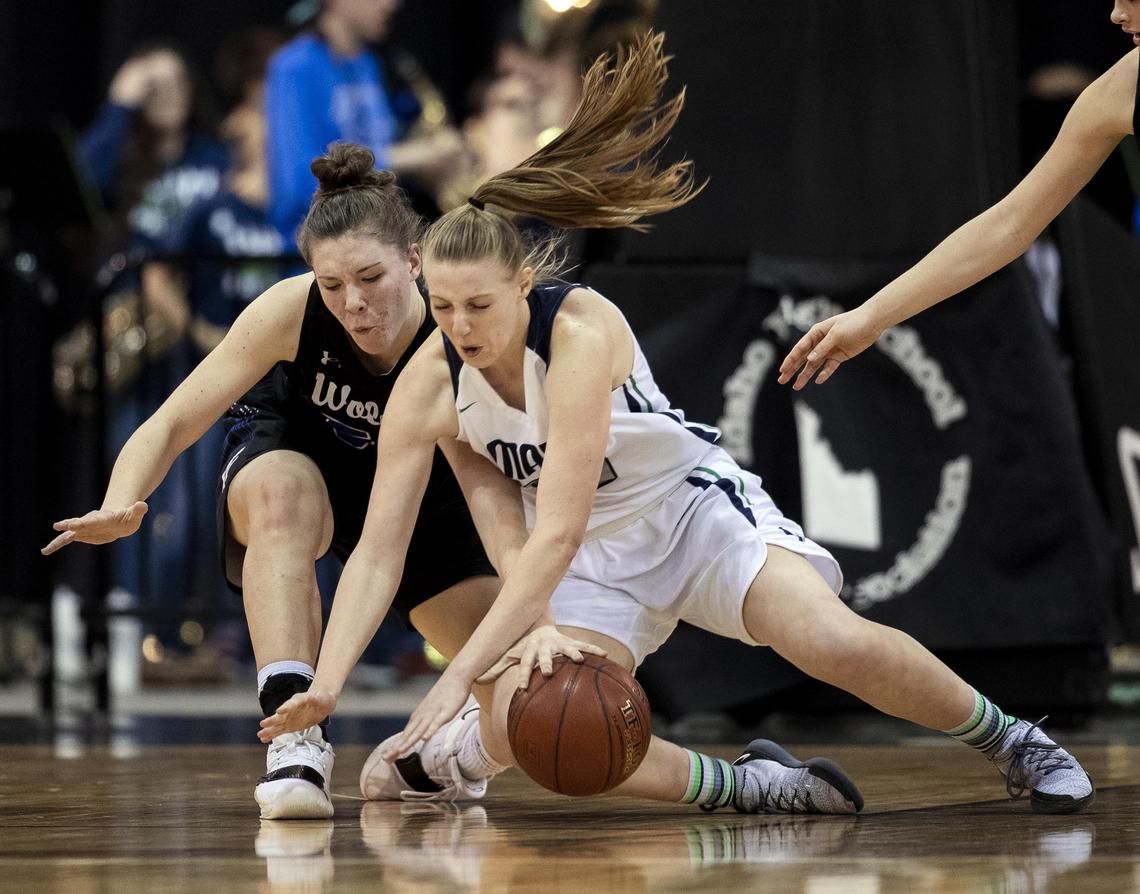 Mountain View senior Emma Anthony dives for a loose ball with Timberline’s Sophie Glancey in the state 5A girls basketball semifinals Friday, Feb. 15, 2019 at Ford Idaho Center in Nampa.