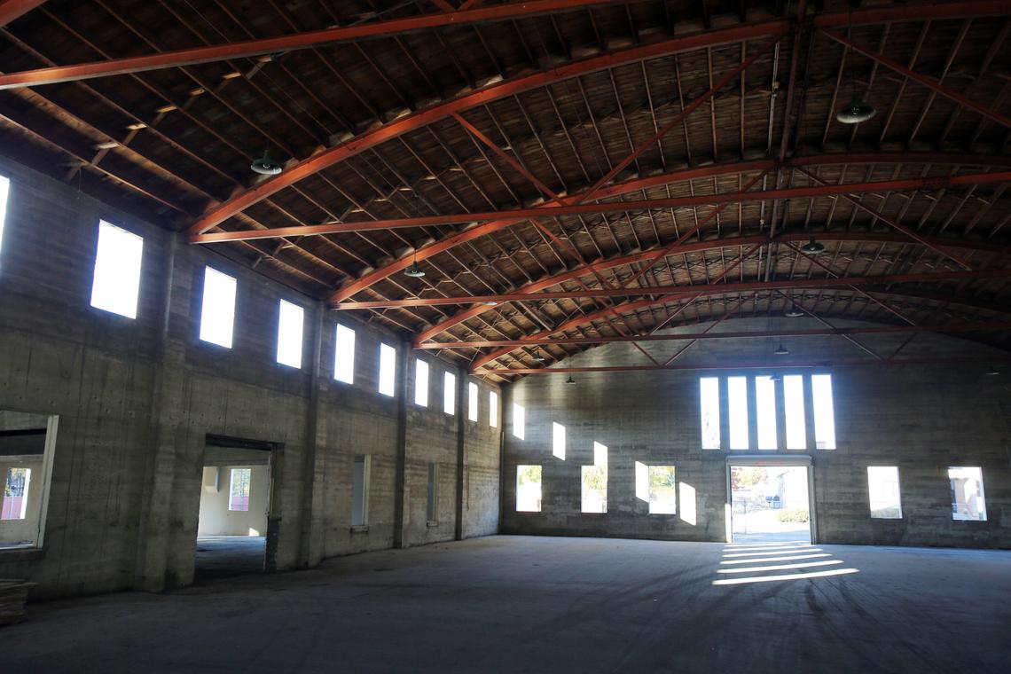 The central section of the armory is the drill hall, a 180- by  80-foot barrel-vaulted open space enclosing approximately 14,400 square feet.