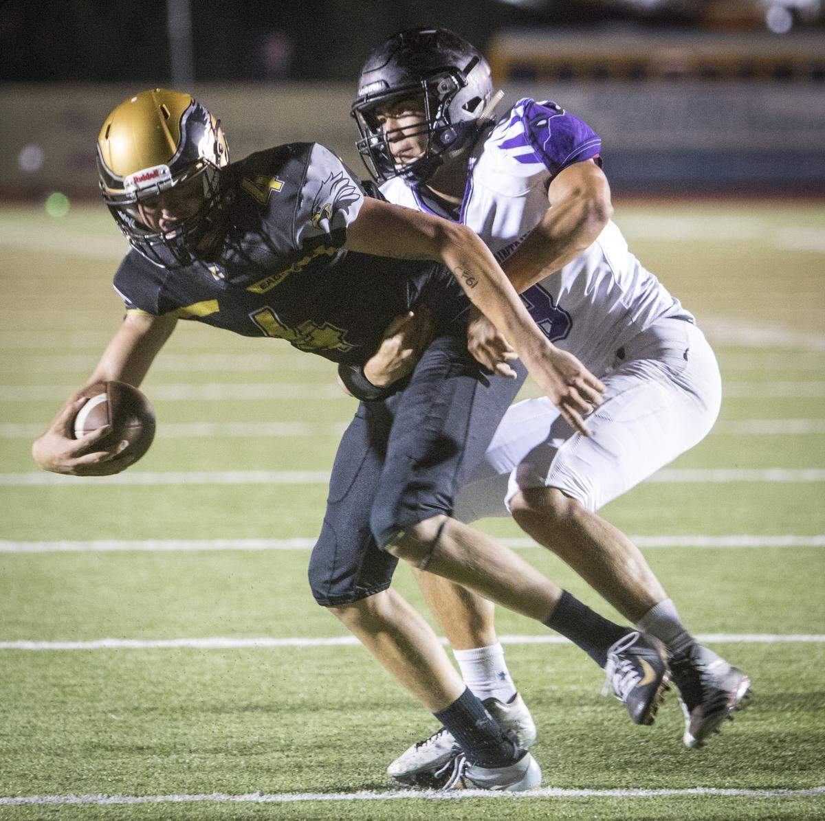 Rocky Mountain’s Joe Strickland drop Capital quarterback Ryan Hibbs for a sack Sept. 7 at Dona Larsen Park.